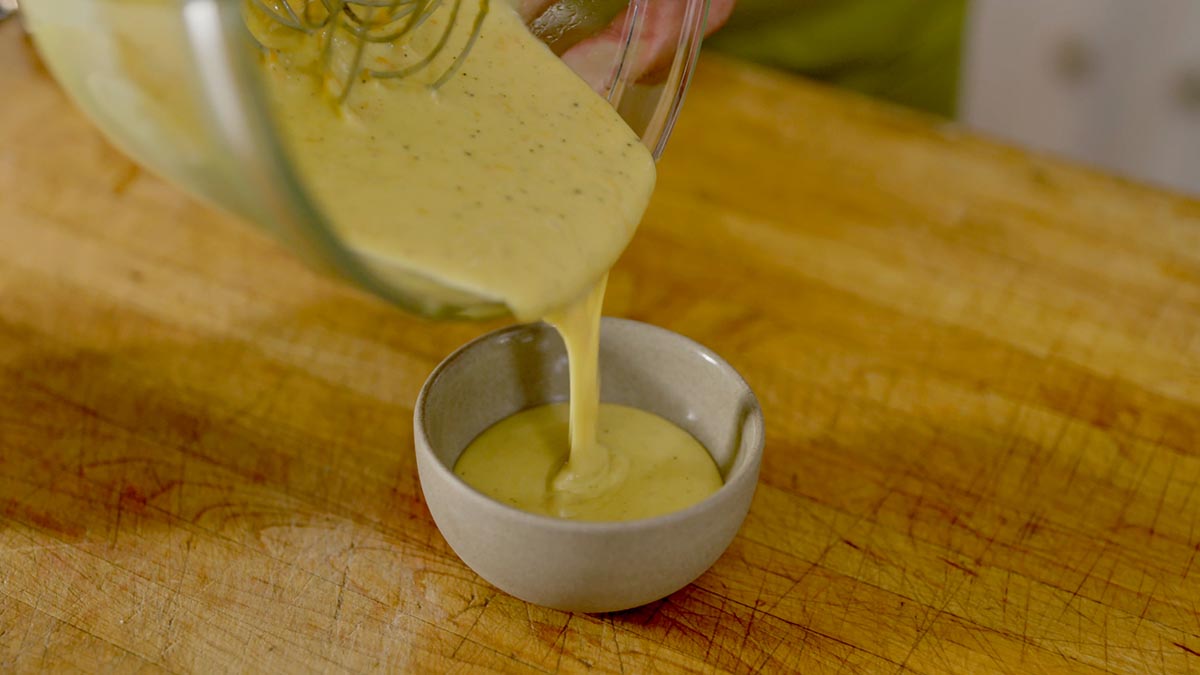 À la minute Miso Hollandaise Sauce. One of the most intriguing components of this dish is the creamy egg yolk sauce, a riff on the classic Hollandaise sauce with miso paste, bringing a rich and umami-packed contrast to the light tasting fish.