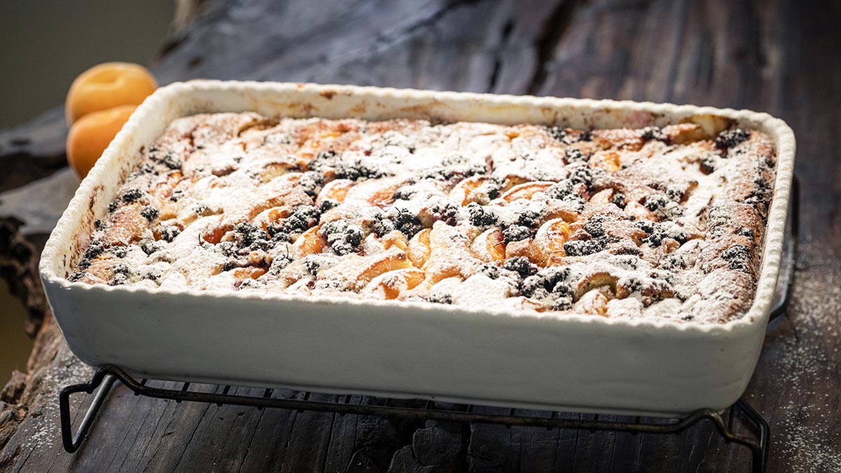 Rustic Summer Cake. Erez teaches a simple, sweet, summery cake straight from his childhood. This quick confection is based on a batter of butter, flour, sour cream, and lemon zest, and topped with juicy fresh apricots that are roughly halved and dunked waist-deep in the batter.