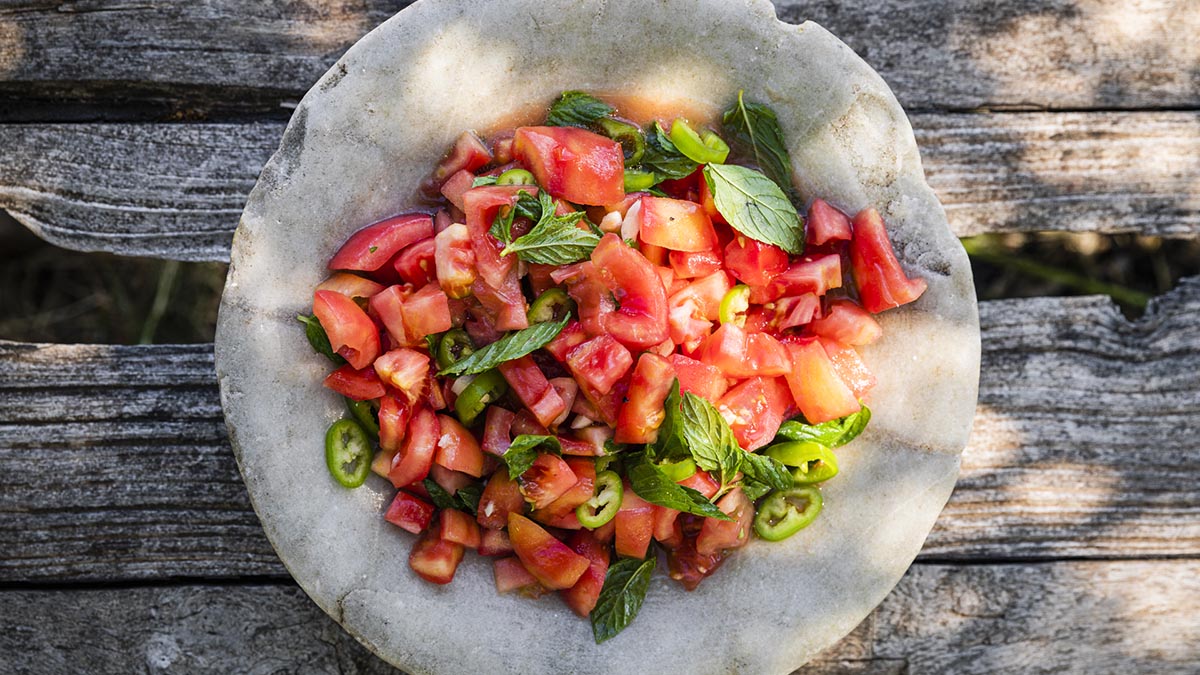 Tomato Salad with Mint & Chili. Not just a tomato salad, Erez takes it to new heights by adding his favorites, mint, and chili. Learn how to make this summery salad and get inspired by its flavors.