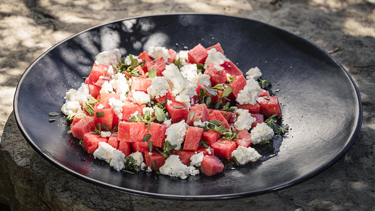 Watermelon & Feta Salad with Purslane. Simple, sweet, and salty. This unique salad is bursting with fresh flavors of goat cheese and bright greens. Let Erez show you a delectable salad using the pink wonder that is watermelon.