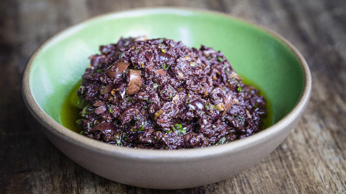 Black Olive Tapenade. A tapenade packed with savory umami flavors, your mozzarella bar would be incomplete without it.