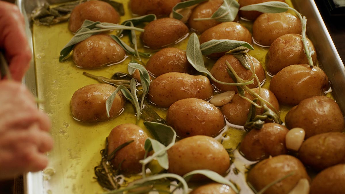 Potatoes. Learn how to coax the best texture and flavor out of earthy butter potatoes by first confit-ing them in oil, butter, garlic cloves, fresh rosemary and sage.
