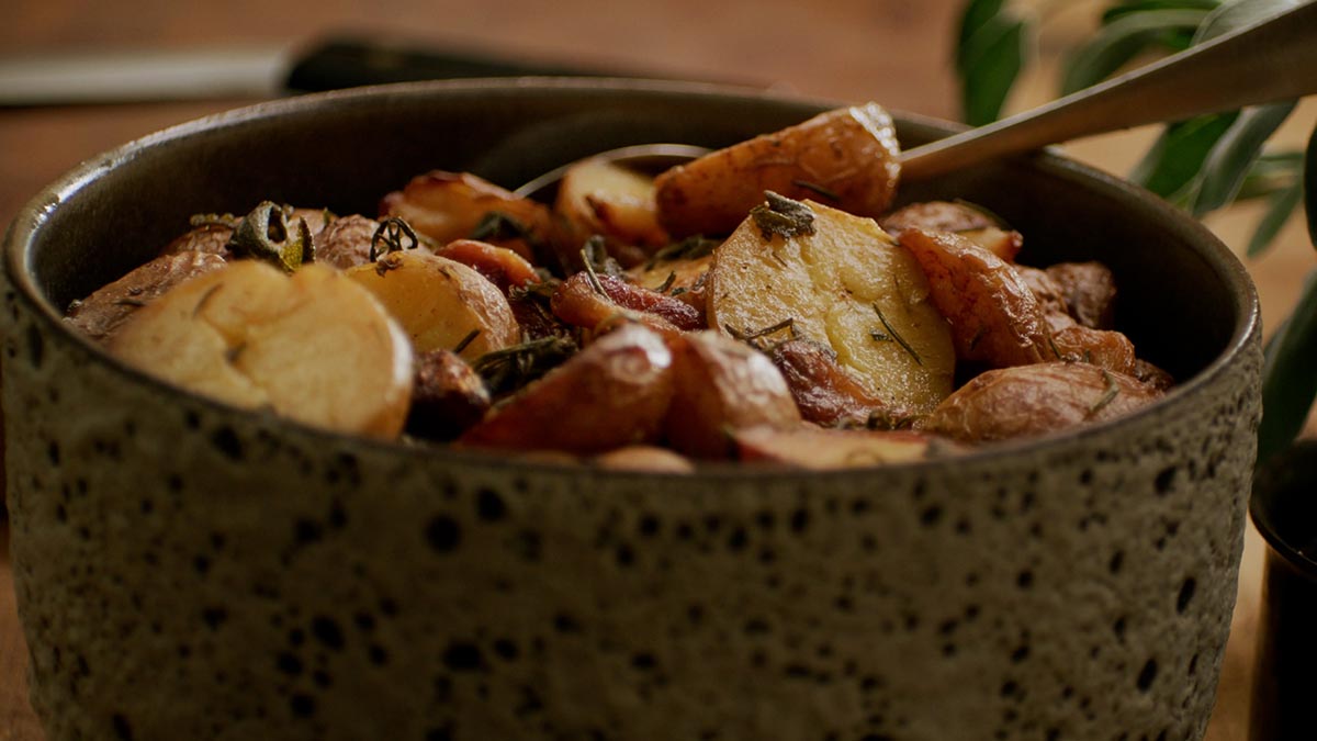 Roasted Potatoes with Bagna Cauda. Learn how to coax the best texture and flavor out of earthy butter potatoes by first confit-ing them in oil, butter, garlic cloves, fresh rosemary and sage.